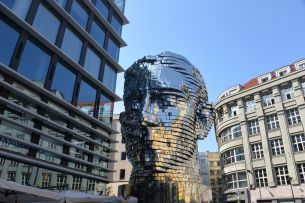 Two sculptures of Franz Kafka show the two faces of Prague – the romantic and consumerist one